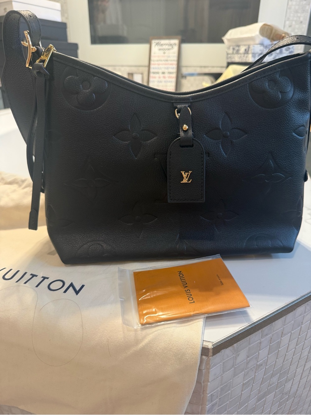1.1 LV Black Monogram Empreinte Shoulder Bag with Gold Accent